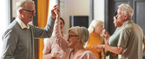 A group of older adults dancing