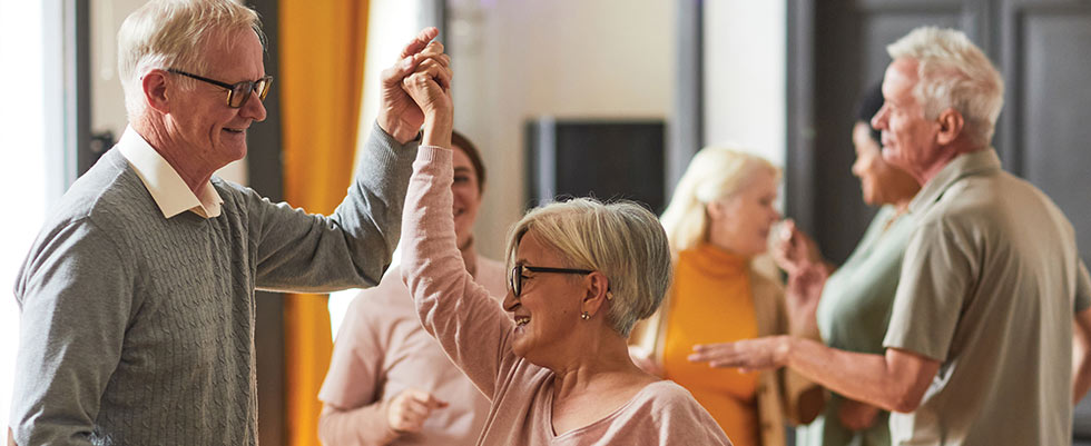 A group of older adults dancing